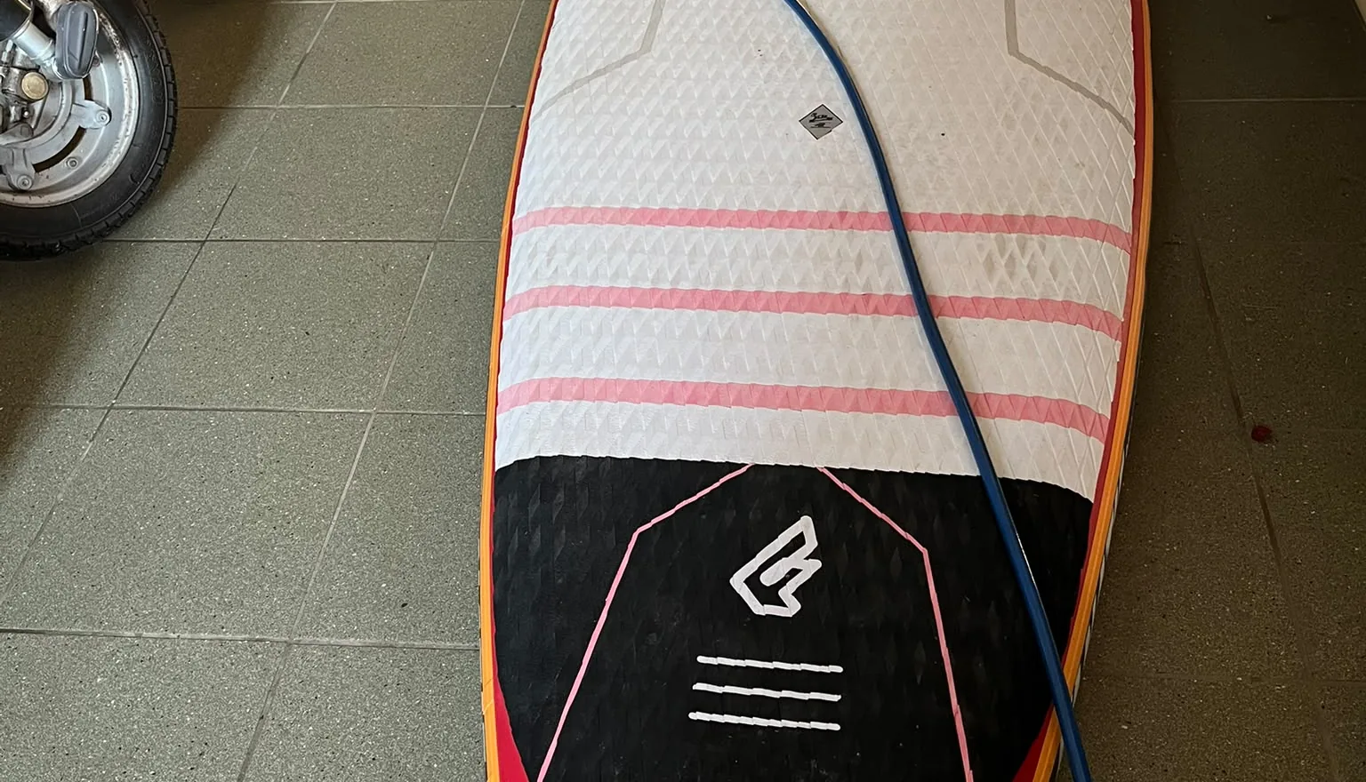 Inflatable Fanatic SUP being pumped up and leak-tested in the workshop
