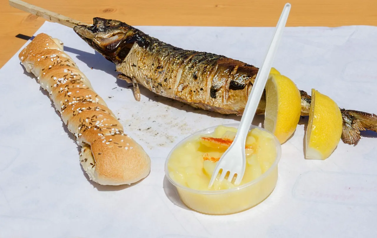 Fisch Hager – Grilled fish on a stick at the Traunfall waterfall